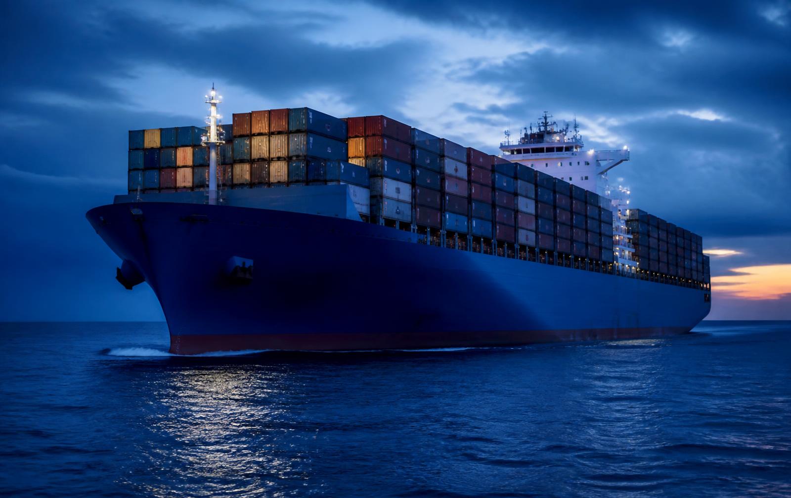 Container ship loaded with containers sailing on the open ocean